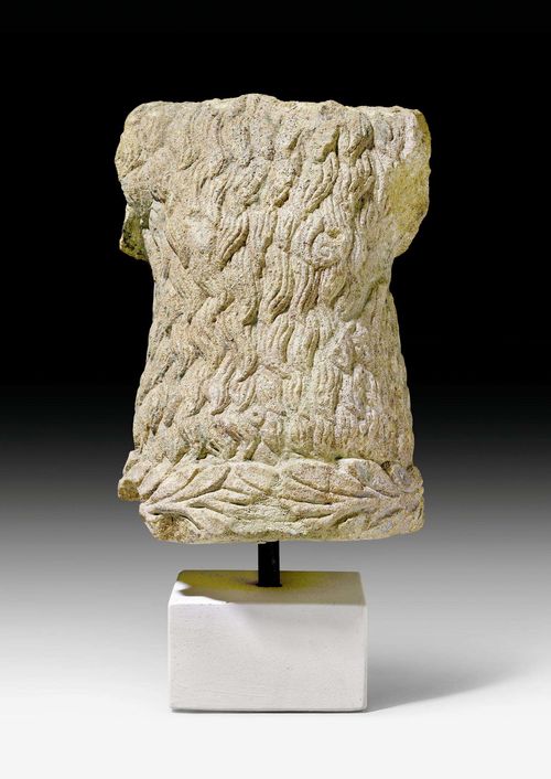 FRAGMENT OF A FOUNTAIN FIGURE,Renaissance, Switzerland, 16th century. Limestone. Torso of a so-called "wild man" with remains of old painting. Mounted on beige wooden base. H 40 cm.