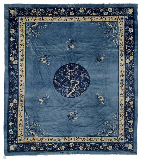 CHINA antique.Light blue central field with a dark blue central medallion, patterned with plants and birds, double-stepped border in beige and blue with trailing flowers, in good condition, 343x385cm.