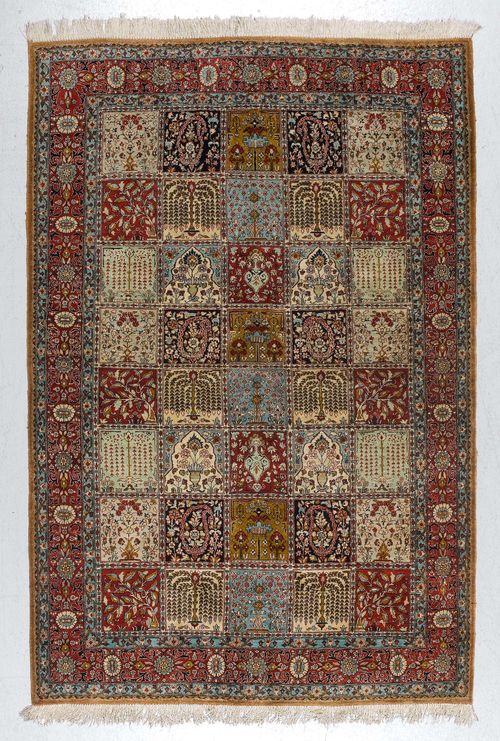 GHOM SILK, GARDEN CARPET.Central field divided into squares, patterned with plant motifs, red border with trailing flowers, in good condition, 135x214cm.