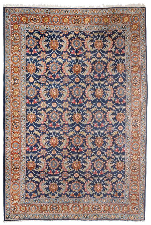 TABRIZ old. Dark blue central field patterned throughout with trailing flowers and palmettes, rust coloured edging, in good condition, 392x287 cm.