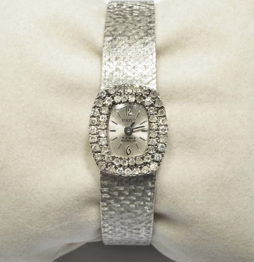 DIAMOND LADY'S WRISTWATCH, PAGY, 1960s. White gold 750, 43g. Tonneau-shaped case with diamond lunette weighing ca. 0.70 ct. Silver-coloured dial with applied indices and baton hands, signed Pagy. Hand winder. Satin-finished Milanaise band. L 18 cm.