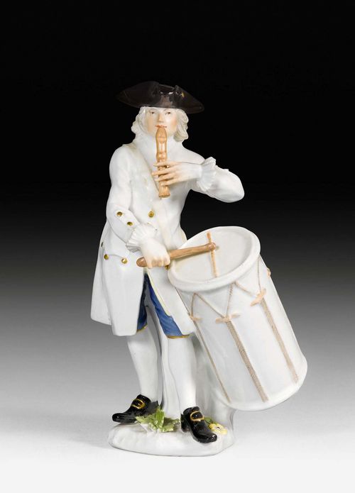 CRIS DE PARIS' FIGURE WITH DRUM AND FLUTE,Meissen, circa 1745. The model probably by Peter Reinicke. Underglaze blue sword mark on the back of the base. H 19.5 cm. Small repair to the hat, slightly chipped. Provenance: Prof. Herbert Albrecht collection, Rheinfelden.