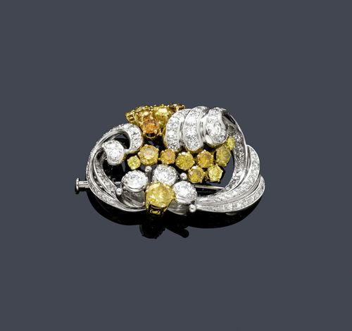 DIAMOND BROOCH, E. MEISTER, ca. 1970. Platinum 950 and yellow gold 750. Classic-elegant, florally designed brooch set with 17 large, naturally coloured, yellow and orange fancy brilliant-cut diamonds weighing ca. 3.20 ct in total, and 80 brilliant-cut diamonds and single-cut diamonds weighing ca. 3.00 ct in total. Signed Meister. Pin in white gold. Ca. 4.3 x 3 cm. With case. Tested by Gemlab.