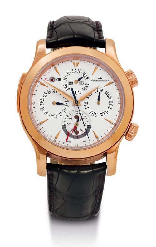 JAEGER LE COULTRE GRAND REVEIL, PERPETUAL CALENDAR WITH ALARM, ca. 2007. Pink gold 750. Ref. 149.2.95 Solid, polished case No. 2414678. Crown for setting the alarm at 2h, crown for setting the time at 4h, toggle switch for choosing between bells or vibration for the alarm at 10h. Sapphire glass. Matte-silver dial with applied gold indices, additional dial for date, day, month and moon phase, year indication at 12h, alarm / vibration display at 11h, alarm hand extends from the centre. Automatic Cal. 919, rhodium plated with Geneva stripes. Black crocodile band with original double fold-over clasp in pink gold. D 43 mm. With original case, instructions and service warranty Jaeger le Coultre October 2014.