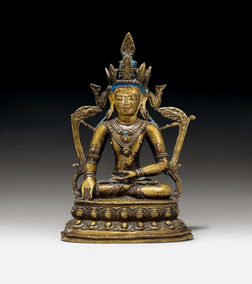 A BRONZE FIGURE OF AKSHOBYA WITH SILVER, COPPER AND STONE INLAYS. Tibet 13th/14th c. H 18 cm. Consecration plate lost.