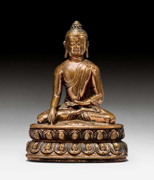 A COPPER ALLOY BUDDHA SHAKYAMUNI WITH VAJRA. Tibet, 14th c. Height 9 cm. Remains of gilding.