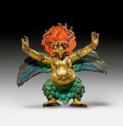 A PARTLY GILT AND POLYCHROME PAINTED COPPER ALLOY RELIEF FIGURE OF GARUDA. Tibet, ca. 18th c. Height 14 cm.