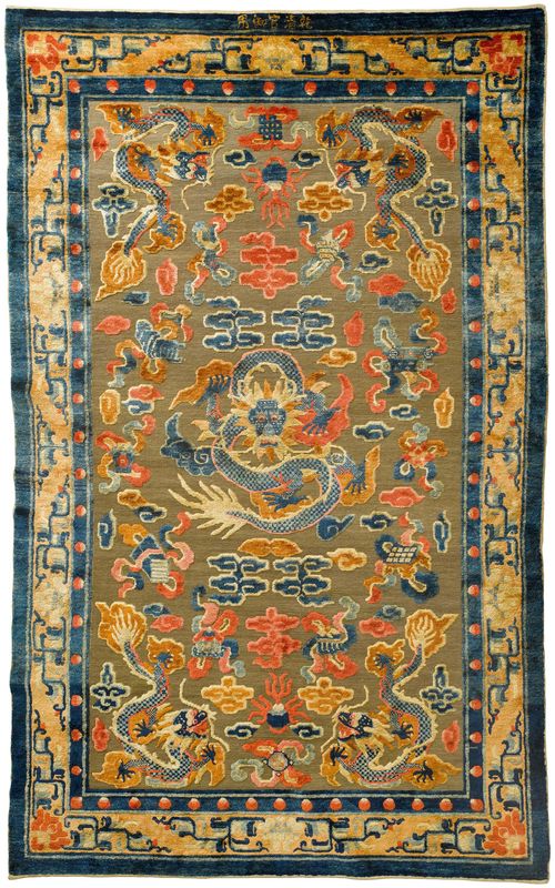 AN IMPERIAL SILK AND METAL THREAD CARPET WITH FIVE DRAGONS. China, late Qing dynasty, 252x153 cm.  Inscribed: "Qianqinggong yu yong".