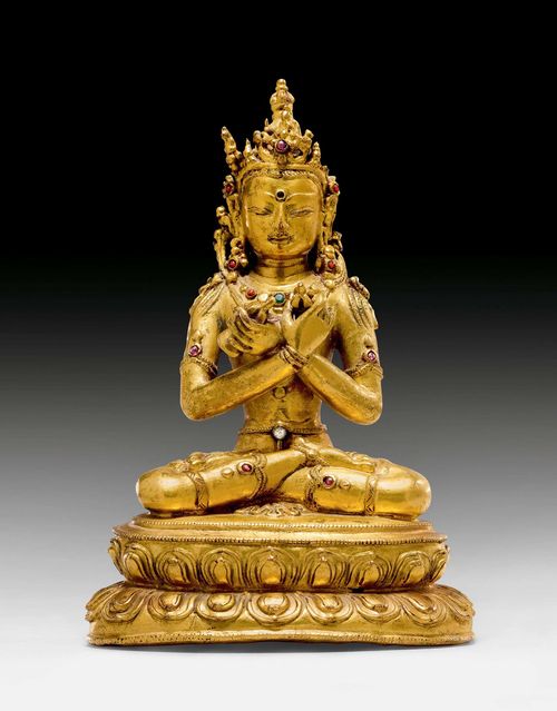 A GILT COPPER FIGURE OF VAJRADHARA. Tibet, ca. 16th c. Height 14 cm. Some inlays replaced. Partly regilt.