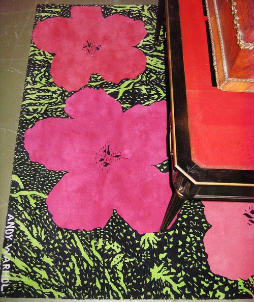 DESIGNER RUG.Andy Warhol, black with green central field with four flowers, good condition, 180x185 cm.