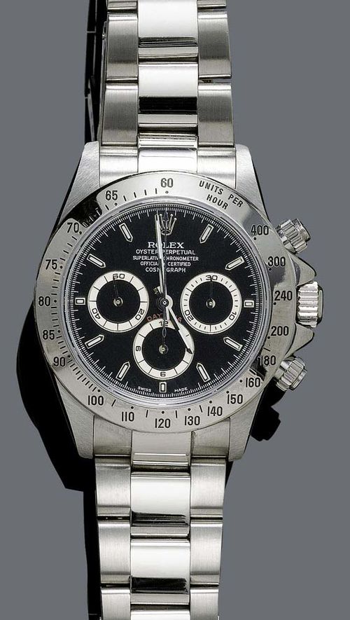 GENTLEMAN'S WRISTWATCH, ROLEX COSMOGRAPH DAYTONA, 2000. Steel. Ref. 16520. Steel case No. A954758, with graduated lunette and screw-down back. Black dial with luminous indices and hands, 3 chrono counters. Automatic, movement No. 203722 Cal. 4030 Zenith. Original Oysterlock steel band with fold-over clasp. D 39 mm. With box, warranty 2000, overhaul warranty December 2008.