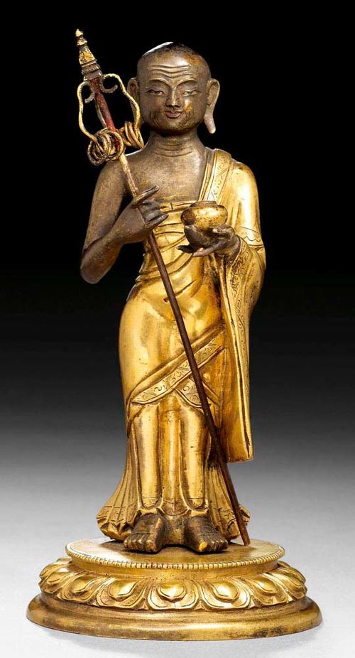 BEGGING MONK.Sino-Tibetan, 18/19th century  H 16 cm. Gilt copper alloy, with the skin ungilded. The garment edges engraved. The figure and plinth joined. Acquired May 1988, Galerie Koller