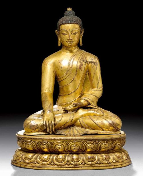 BUDDHA SHAKYAMUNI.Tibet, 17th century  H 25.5 cm. Gilt copper alloy. The throne separately crafted.