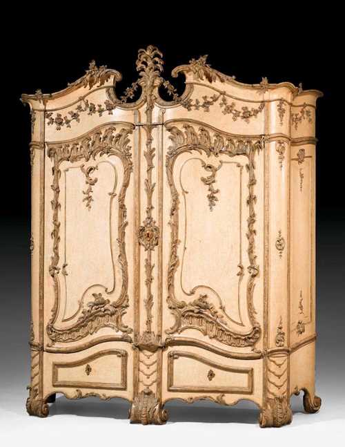 IMPORTANT PAINTED CABINET,Louis XV, by J.A. NAHL (Johann August Nahl, 1710-1781), Potsdam circa 1750/60. Exceptionally finely carved wood, painted ivory color and partly silvered. Interior painted red. 200x66x246 cm. Provenance: - Fischer-Boehler, Munich. - Private collection, Germany.