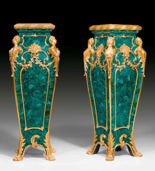 PAIR OF MALACHITE PEDESTALS "AUX ESPAGNOLETTES",Louis XV style, after models by F. LINKE (Francois Linke, 1855-1946), probably Russia. Malachite with matte and polished gilt bronze. 34x34x117 cm.