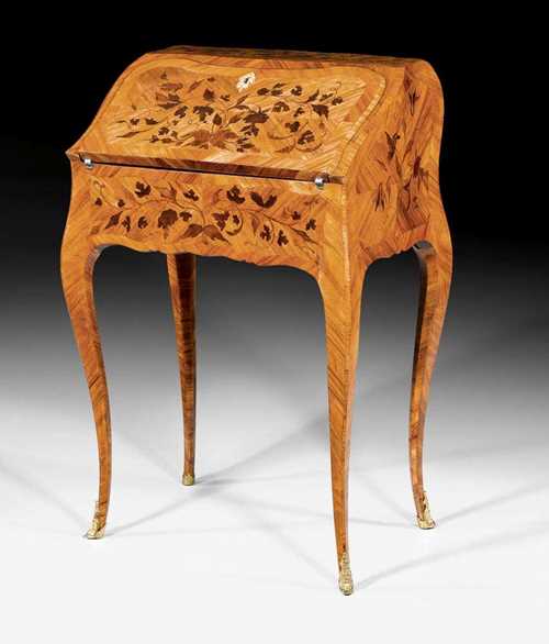 SMALL LADY'S DESK,Louis XV, from a Paris master workshop, probably  by B. VAN RISENBURGH (Bernard II Van Risenburgh, maitre 1735) or J. DUBOIS (Jacques Dubois, maitre 1742), circa 1760. Tulipwood and rosewood veneer also finely inlaid in "bois de bout" with flowers, leaves and frieze. The desk with bombé form on all sides with tall shaped legs and a sloped leather-lined writing surface, the fitted interior with drawers and compartment with a secret compartment. Decorated with fine matte and polished gilt bronze mounts and sabots. Freestanding. 56x40x(open 67)x88 cm. Provenance: from an important European collection