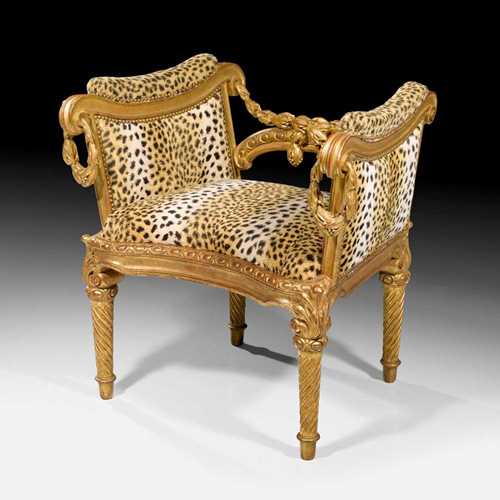 BANQUETTE, known as a "bergère à l'italienne",Louis XVI, attributed to C. CHEVIGNY (Claude Chevigny, maitre 1768) after designs by J.C. DELAFOSSE (Jean Charles Delafosse, 1734-1789), Paris circa 1770. Fluted, shaped and richly carved gilded beech. The covers in velour with panther pattern. 72.5x51x45x73.5 cm. Provenance: private collection, Paris