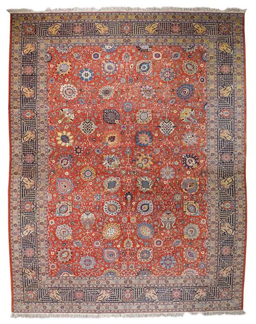 SENNEH old.Dusky pink background, patterned throughout with trailing flowers and palmettes in attractive colours, blue border with a floral pattern, slight wear, 430x330 cm.