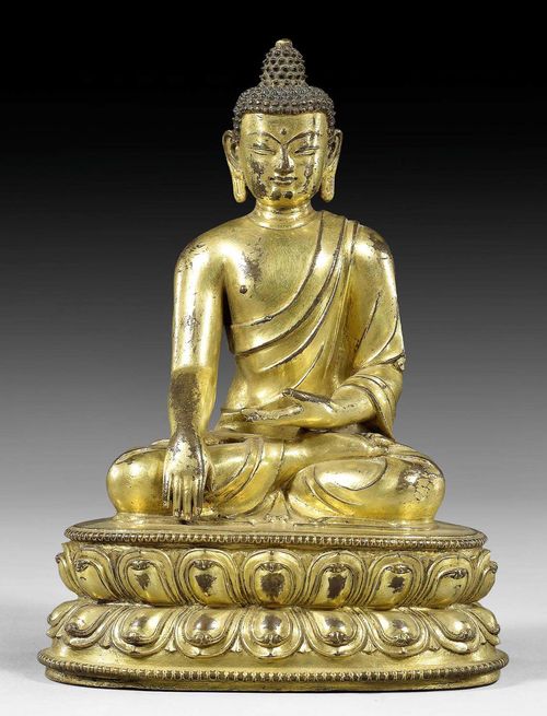 A GILT COPPER ALLOY FIGURE OF BUDDHA SHAKYAMUNI. Tibetochinese, 15th/16th c. Height 18.8 cm.