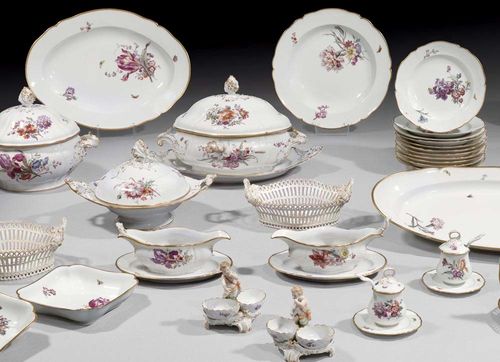 LARGE IMPORTANT TABLE SERVICE, Berlin, KPM, first third of the 20th century.Shaped forms with rocaille handles heightened in gold and gold edges. Each piece painted with floral bouquets and flying insects. Comprising: 1 large oval soup tureen with lid, 1 oval serving dish, 2 serving dishes with lids, 1 round soup tureen with lid, 7 oval dishes of various sizes, 2 fish dishes, 6 round dishes in various sizes, 2 openwork oval fruitbaskets, 4 round small bowls with opening, 2 small oval bowls with opening, 4 sauce boats, 2 leaf-shaped dishes, 2 cups, 2 square vegetable dish, 4 flat square bowls, 4 sauce spoons, 2 mustard pots with lid and spoon, 4 figural salt pots, 72 dinner plates, 24 soup plates, 24 smaller plates, 24 bread plates, 22 dessert plates. Underglaze blue  sceptre mark, imperial apple and KPM in iron red, stamped mark. (226)