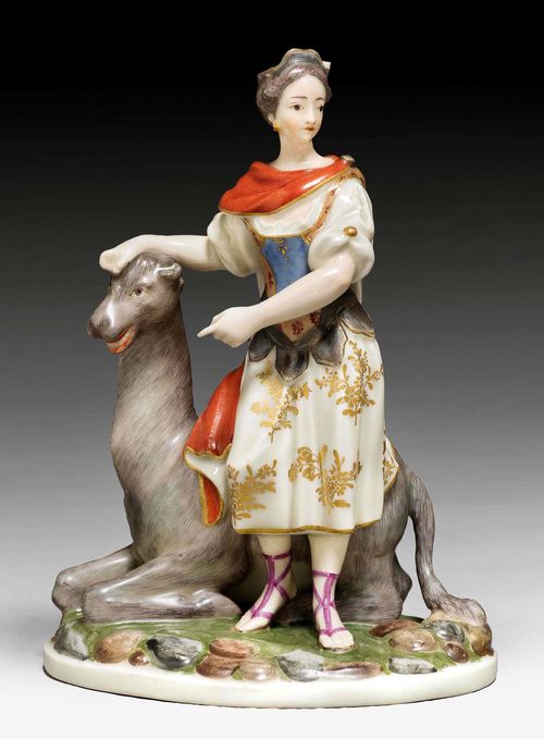 GIRL WITH LYING CAMEL AS AN ALLEGORY OF ASIA, ZURICH, MODEL CIRCA 1770-75.Form 162. Dressed in antique habit with iron red 'sagum' shawl. Underglaze blue mark Z and impressed mark N and two dots. H 17 cm. Minor chips on diadem. Provenance: Private collection, Zurich, 1978. Comparable pieces: Ducret II, ill.218; Schwarzenbach 1974, Lot 78.