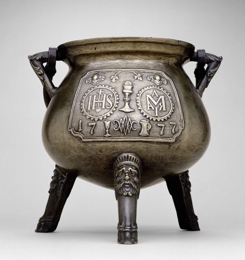 CAULDRON, Southern Germany, dated 1777. Bronze with relief decor and monograms IHS and M. H 30 cm.