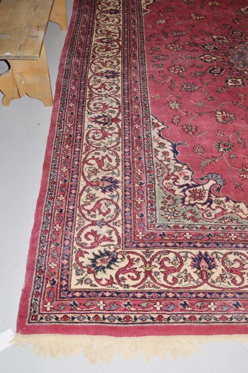 INDO TABRIZ old. Pink ground with a green central medallion, patterned with stylised trailing flowers, white border, good condition, 280x360 cm.