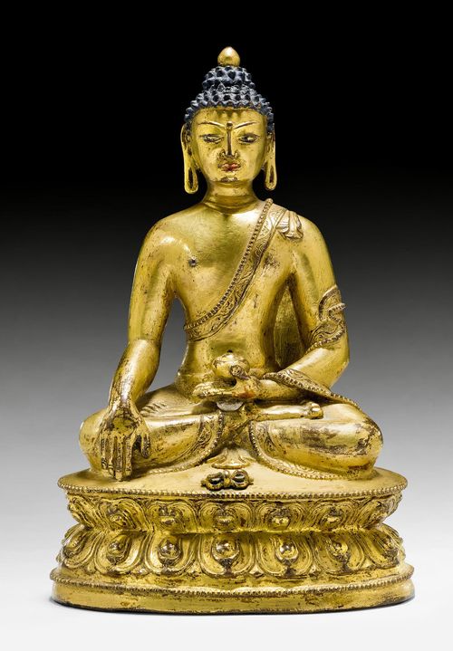 A GILT COPPER ALLOY FIGURE OF BUDDHA SHAKYAMUNI WITH VAJRA. Tibet 14th c. Height 18 cm. Consecration plate lost.