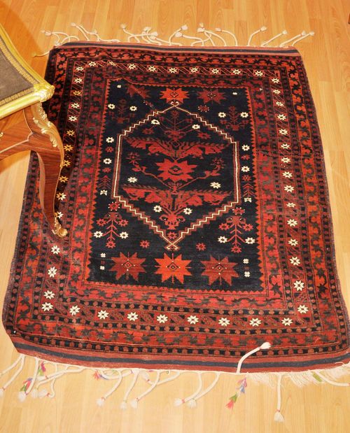 LOT OF 4 TURKISH CARPETS old.A tulip Ladik carpet with a red ground and a white border, 115x195 cm. A Karapinar carpet 110x172 cm. An Anatolian prayer carpet 120x160 cm and a Kurdish carpet 125x150 cm. All in good condition.