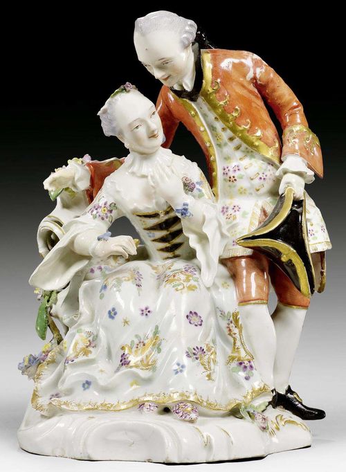 KNIGHT AND LADY, FÜRSTENBERG, CIRCA 1760.Model by Simon Feilner or Johann Christof Rombrich. Set on a shaped rocaille plinth, modelled with a rocaille shaped vase with applied flowers. Number 13 in iron red. H 18 cm. Restored. Provenance: - Private collection, Hamburg. - Via inheritance to a private collection in South Germany
