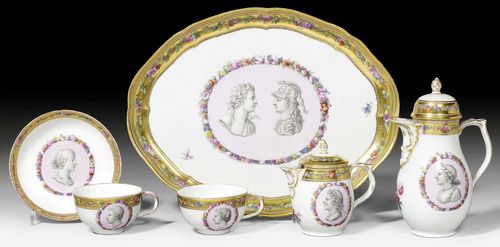 SET FOR ONE WITH GRISAILLE PORTRAITS, BERLIN, KPM, CIRCA 1790.Each piece with a grisaille medallion of antique style portrait on a pink ground set in an oval floral medallion, with scattered flowers and a floral border on a gold ground around the edge. Comprising: a tray, a coffee pot, a milk jug with lid and a cup with saucer; also a further cup. Underglaze blue sceptre mark. The tray D 32.5cm, coffee pot H 17.8cm. The spout of the coffee pot with old restoration at the end, the gilding slightly rubbed at the edges. (8)