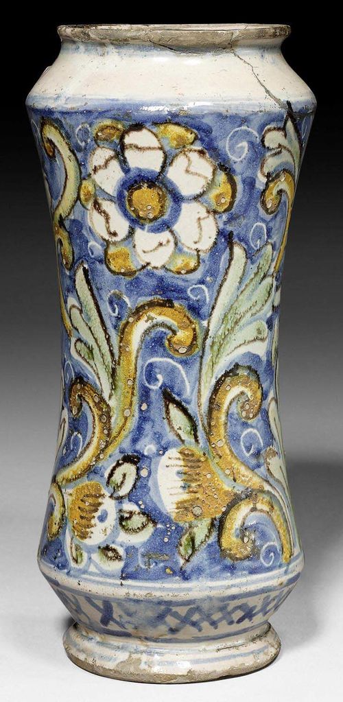 ALBARELLO, SICILY, CALTAGIRONE, 18TH CENTURY.Painted with palmettes and flowers in green and ochre yellow on a blue ground, with flourishes in white reserves. H 27cm. Repairs to the edge.