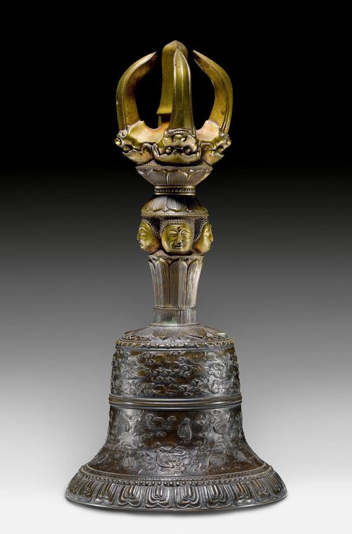 A BRONZE AND BELL METAL GOKOREI RITUAL BELL. Japan, 19th c. Height 32 cm. Remains of gilding on the handle.