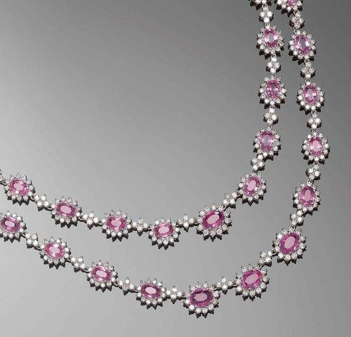 SAPPHIRE AND BRILLIANT-CUT DIAMOND NECKLACE. White gold 750. Very decorative, fancy necklace, changing into two rows towards the front, set with 40 pink oval sapphires totalling ca. 25.00 ct in a brilliant-cut diamond surround, and interconnected with small floral motifs set with brilliant-cut diamonds. Total diamond weight ca.11.00 ct. L ca. 41 cm.