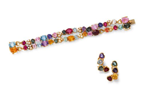 GEMSTONE AND DIAMOND BRACELET WITH EAR CLIPS. Yellow gold 750. Very attractive, double-row bracelet, each of 2 flexible lines of different, synthetic gemstones in different shapes and colours, e.g. 1 synthetic sapphire, 6 rubies, 5 topazes, amethysts and others, additionally decorated with 8 diamond-set heart motifs. Total weight of the 24 brilliant-cut diamonds ca. 1.00 ct. 4 heart-shaped gemstones are missing. L ca. 18 cm. Matching decorative ear clips with studs, each of 4 heart-shaped stones of different colours.