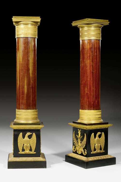 PAIR OF COLUMNS,Empire, Paris circa 1810. Mahogany with matte and polished gilt bronze. H 129 cm. Provenance: - Formally part of the Stroganov Palace collection. - Lebke auction "Kunstwerke aus den Beständen Leningrader Museen und Schlösser", Berlin 1929 (Lot No. 143/144, with ill.). - Galerie Carroll, Munich. - From a very important German private collection.