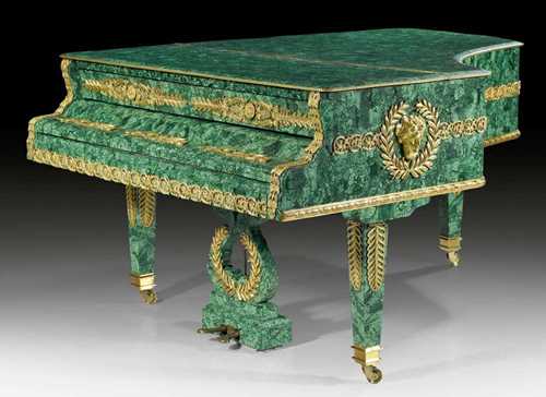 MALACHITE BABY GRAND PIANO,signed in Cyrillic  J. BECKER ST. PETERSBURG (active from 1881), Russia circa 1900 and later. Malachite with matte and polished gilt bronze. Ivory and ebony keyboard over 7 octaves. Exceptionally rich bronze mounts and applications. L ca. 170 cm.
