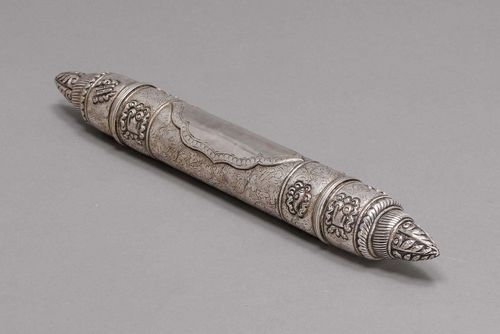 SUTRA SCROLL RECEPTACLE.Tibet, L 34 cm. Silver. Cylindrical shape, in the central area a cartouche on an engraved foliate ground, the intermediate areas wrought with the Astamangalas. Tapered ends. May be opened on one side.