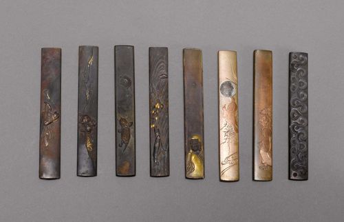 EIGHT KOZUKA.Japan, 18th/19th c. L 9.5-9.8 cm. Various metal alloys. Different decorations with fine details, most with gold, silver or copper damascene and signature. (8)