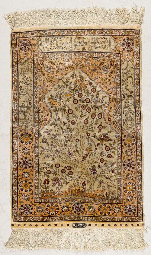 HEREKE PRAYER.White mihrab with beige spandrels, patterned with plants and animals, beige trim, slight wear, 61x95 cm.