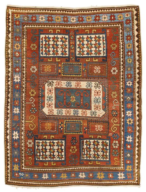 KARATCHOPH antique.Rust-red central field with five large and six small medallions in white, green and rust-red.  The entire carpet is geometrically patterned. Blue border, signs of wear, 150x200 cm.