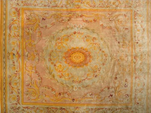 FRENCH SAVONNERIE antique.Old rose ground with floral central medallion in light green. Finely patterned with floral garlands in pastel colours. Good condition, 460x425 cm.