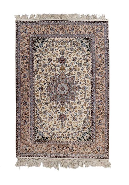 ISFAHAN old.White central field with beige medallion and green corner motifs. Patterned with trailing flowers and palmettes in light blue and beige. Light border. Good condition, 230x155 cm.