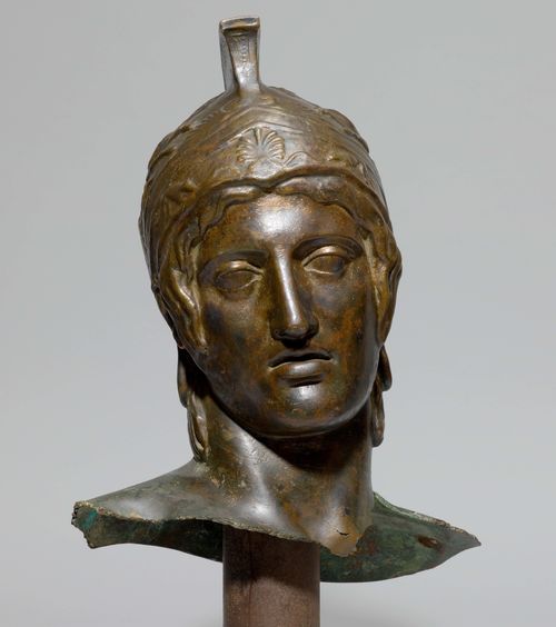HEAD OF A WARRIOR,probably a cast after a model from Antiquity, 20th century. Bronze with brown patina. H 63 cm.