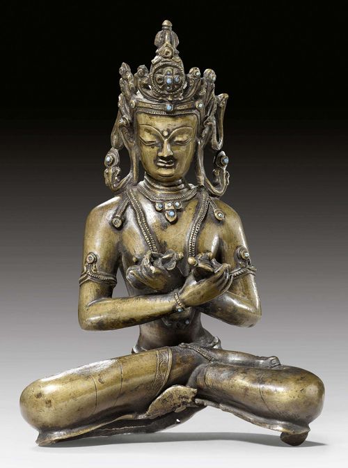 A BRONZE FIGURE OF VAJRADHARA. Tibet, 14th c. Height 22 cm. Lotus base lost, lower edges distorted.