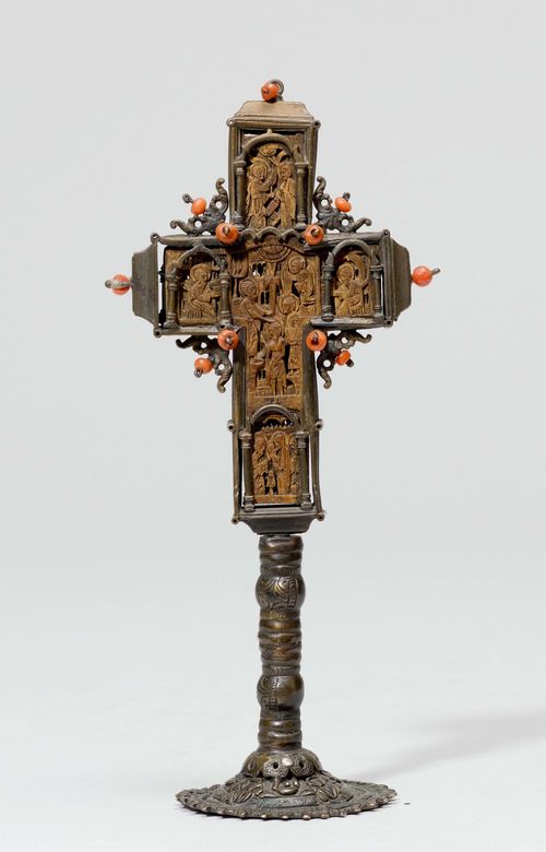 SMALL STANDING CROSS,Greece, probably 18th/19th century. Wood carved in relief with depictions from the life of Christ and the 4 Evangelists. Set in silver-plated brass or copper mount on a round foot. H 18.5 cm.