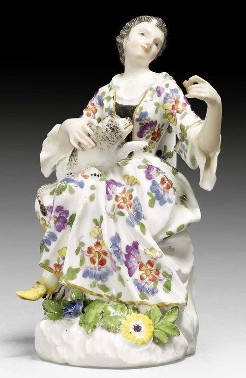 LADY WITH CAT, MEISSEN, MODEL J. J. KAENDLER, CIRCA 1750.Underglaze blue sword mark on the back of the base. H 13cm. Minor restoration.
