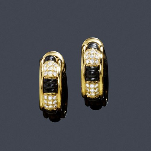 ONYX, CORAL, WOOD AND DIAMOND EAR CLIPS, BOUCHERON. Yellow 750. Very decorative half-creole ear clips with studs, each set with 18 brilliant-cut diamonds weighing in total ca. 0.60 ct, with three pairs of interchangeable engraved onyx, coral and wood spacers. Signed Boucheron, no. P36136