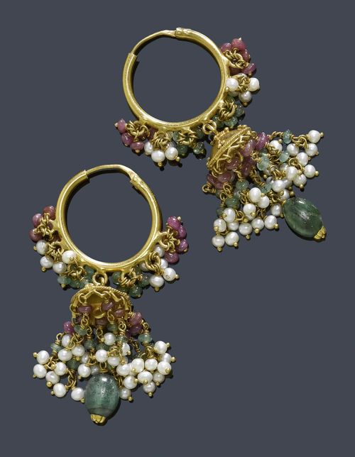 A PAIR OF INDIAN PEARL, RUBY AND EMERALD EAR PENDANTS. Decorative circular earrings with suspended bunches of ruby and emerald beads and small pearls, accented with 1 lens-shaped emerald suspension.