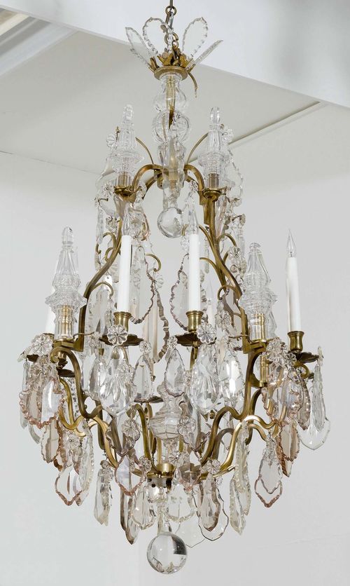 A LARGE CRYSTAL GLASS CHANDELIER , Baroque style, 19th century. Brass and glass. 8 branches. H 120, D 72 cm. Fitted for electricity.